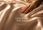 A close-up of a hand resting on draped champagne satin fabric with elegant text overlay reading 'Luxury Begins With Touch' and smaller descriptive copy below.